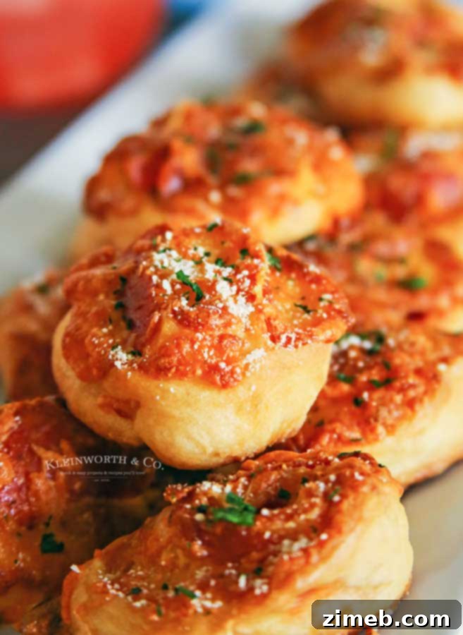 10 Ghoulish Halloween Party Treats 9 Cheesy Pepperoni Pizza Pinwheels recipe, perfect for parties