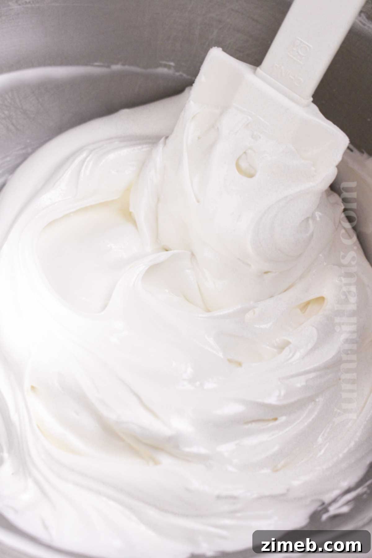 Close-up of meringue powder, the key ingredient for safe and stable royal icing.