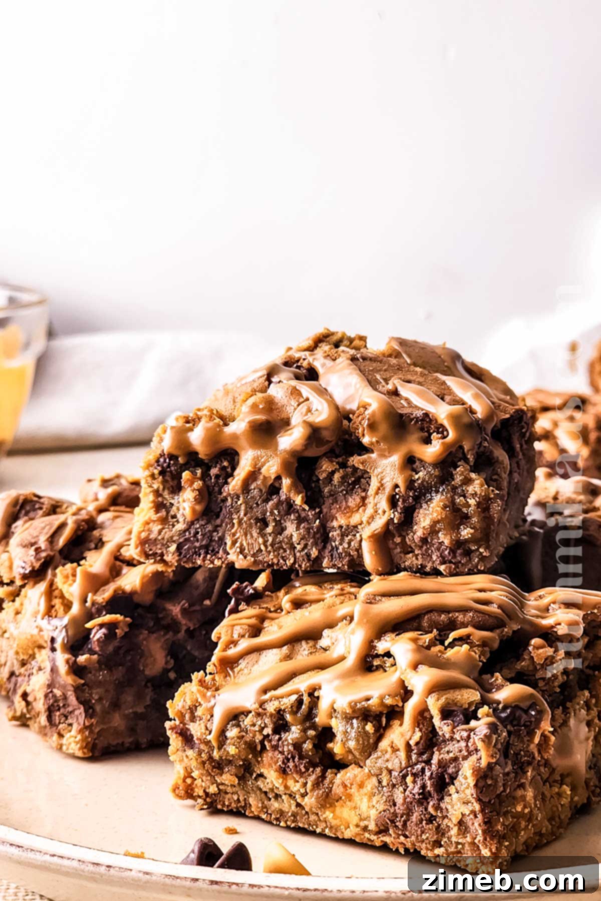 Speculoos Swirl Brownies 11 Biscoff Brownies with cookies on a wooden board