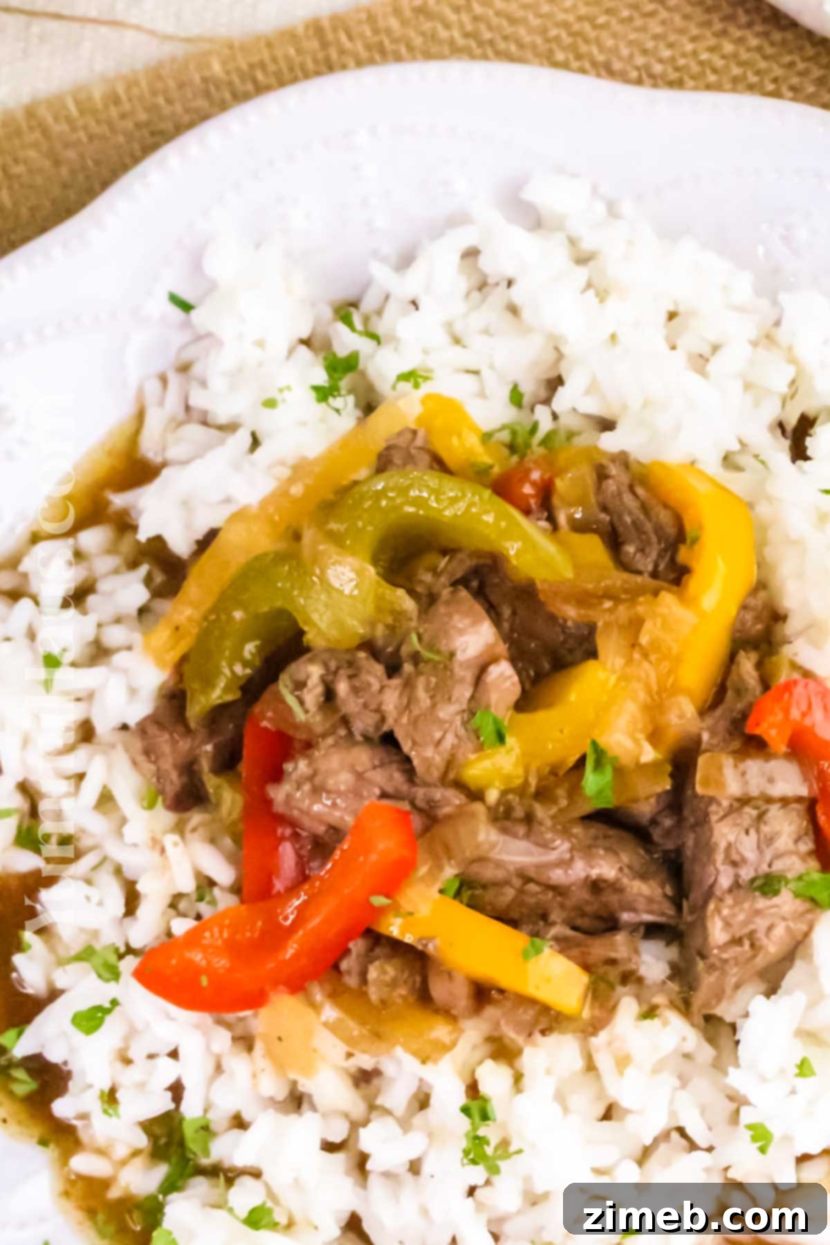 Tender Slow Cooker Pepper Steak 14 Slow cooker pepper steak plated for an easy weeknight dinner.
