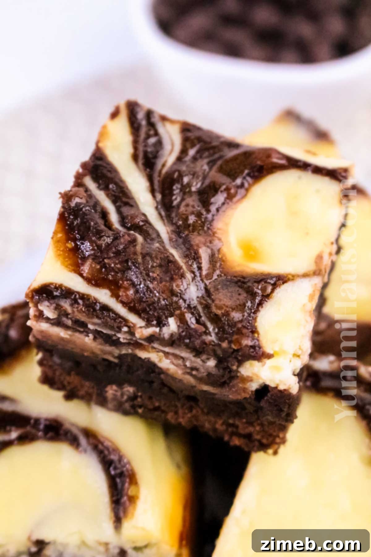 Cheesecake Chocolate Brownies: Rich, fudgy chocolate brownies swirled with creamy cheesecake, an irresistible dessert for any occasion.