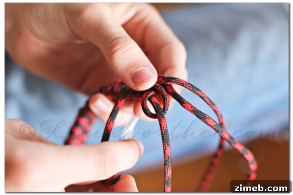 Handmade Fishtail Paracord Dog Collar 15 Continuing weave after D-ring insertion for dog tags