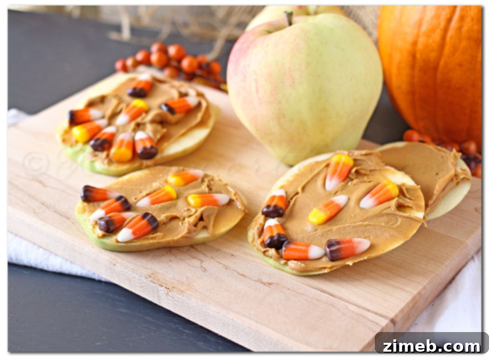 Smiling Jack-o'-Lantern Candy Corn Apple Slices on a plate