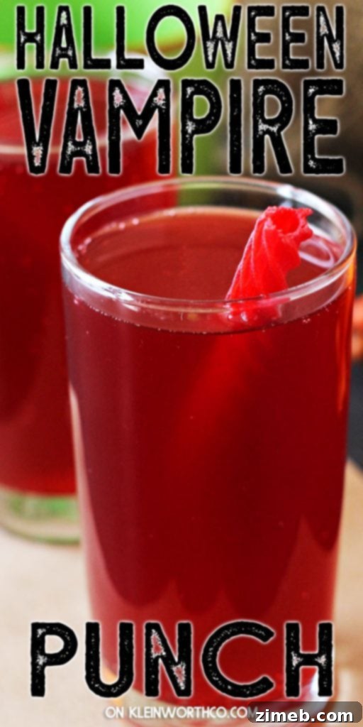 Crimson Fang Punch 2 Vampire Punch Halloween Drink - A vibrant red drink in a spooky setting, perfect for Halloween parties.