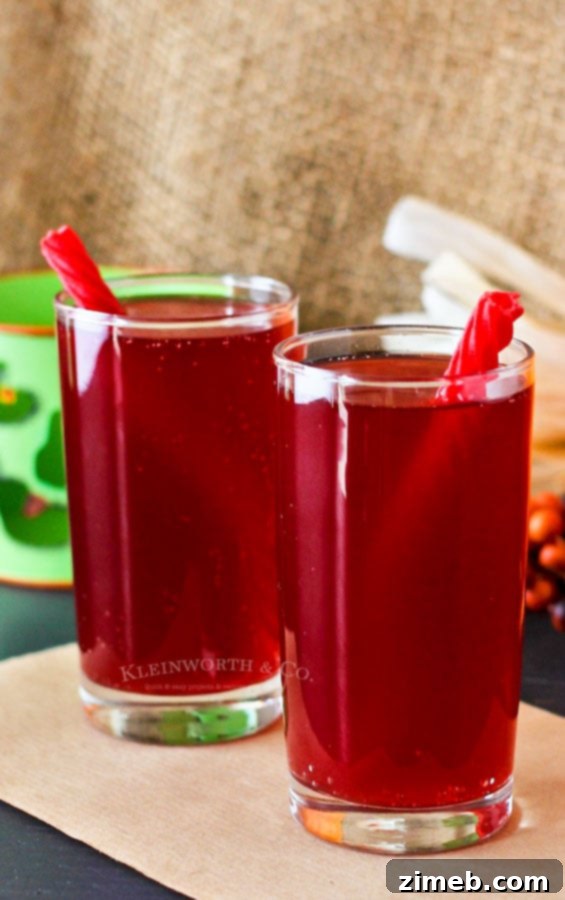 Crimson Fang Punch 3 Easy Halloween punch recipe for kids, featuring a vibrant red color.