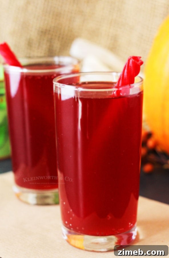 Crimson Fang Punch 5 Kid-friendly Halloween punch, served in a festive cup.