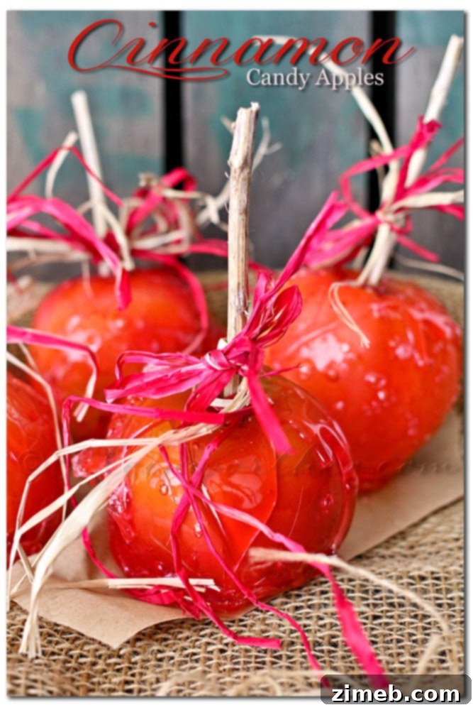Beautifully shiny homemade Cinnamon Candy Apples with wooden sticks