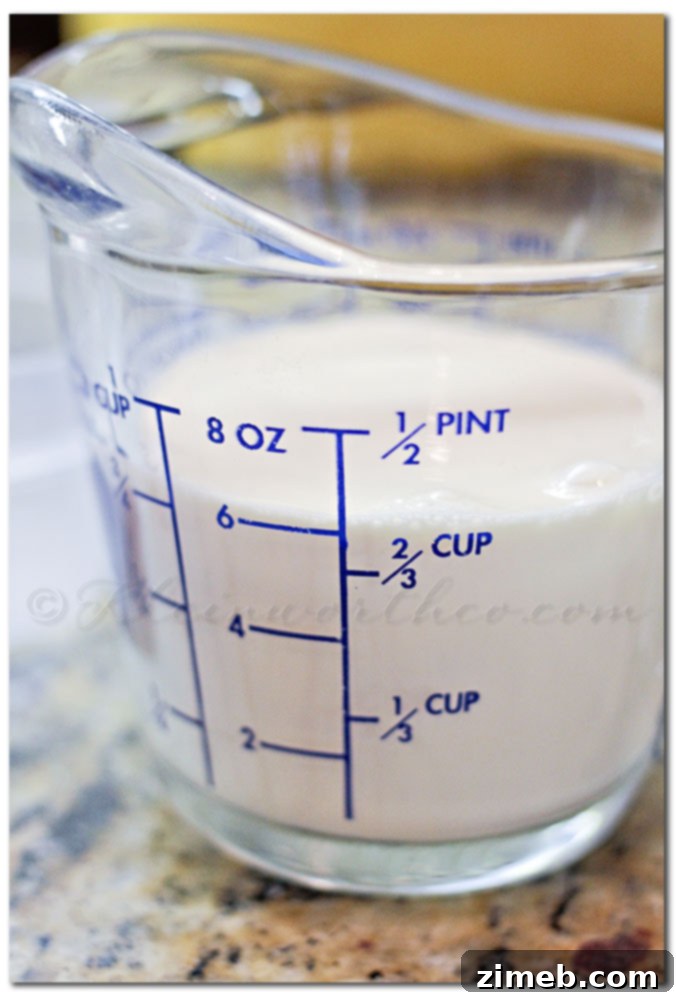 Mixing cake mix, butter, and evaporated milk in a stand mixer for the Game Day Bites batter.