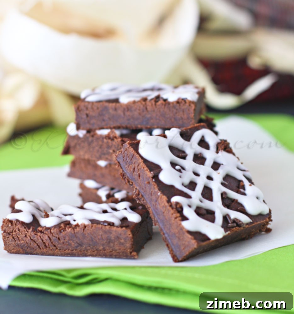 Chewy Spiced Chocolate Gingerbread Bars 6 Close-up of freshly cut Chocolate Gingerbread Cookie Bars with a gentle glaze