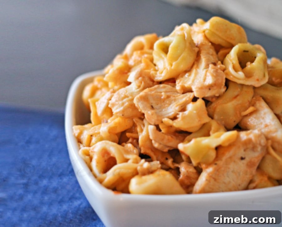 Creamy Vodka Chicken Tortellini 4 A large skillet filled with the creamy vodka and Alfredo sauce mixture, with tender chicken pieces, ready for the tortellini.