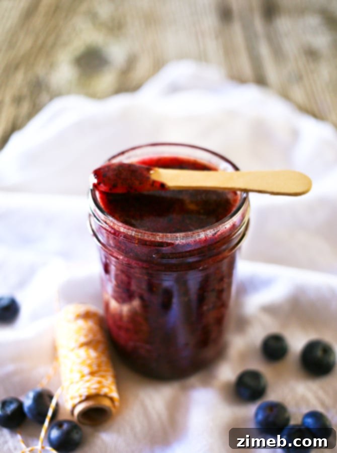 Effortless Blueberry Jam 2 Blueberry Freezer Jam, showcasing vibrant, fresh homemade jam in a glass jar, perfect for spreading.