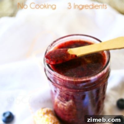 Effortless Blueberry Jam 4 A small jar of homemade Blueberry Freezer Jam, ready to be enjoyed.