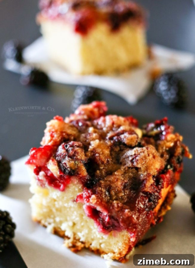 White Chocolate Blackberry Swirl Cake 5 A serving of Blackberry White Chocolate Buckle with a scoop of vanilla ice cream
