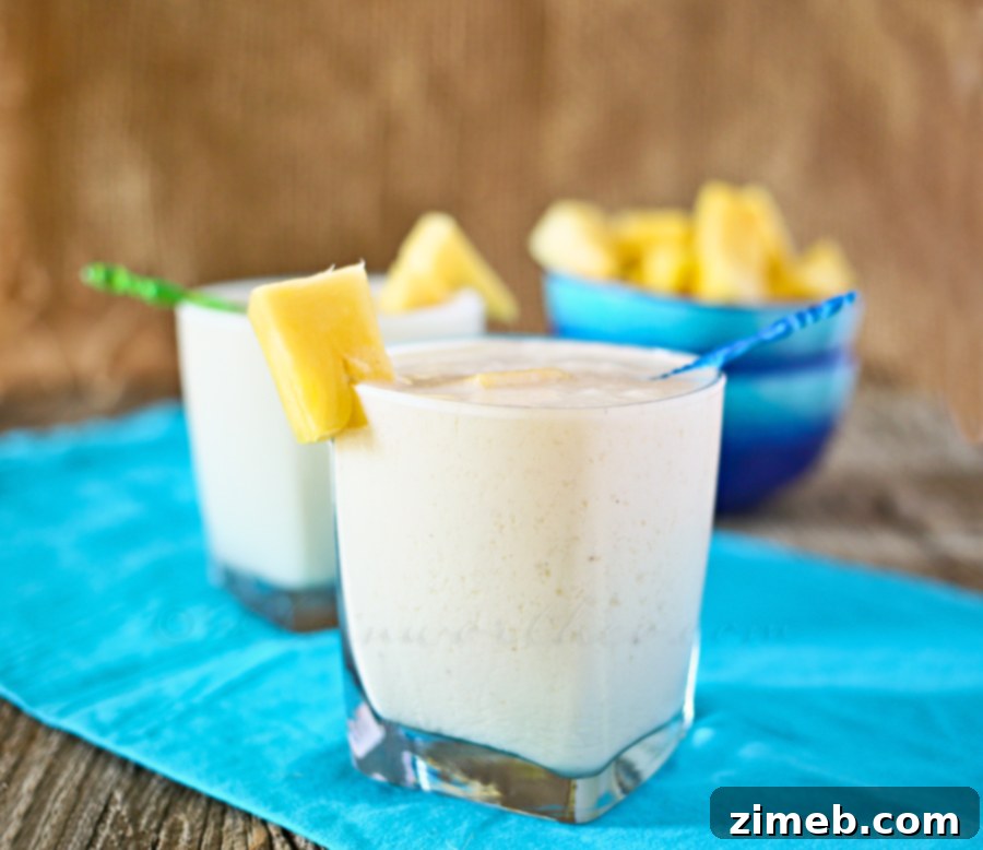 Refreshing Frozen Colada with pineapple garnish