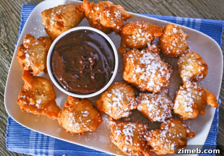 Zeppole: Italian Fried Delights 2 Delicious Zeppole dusted with powdered sugar, ready to be enjoyed