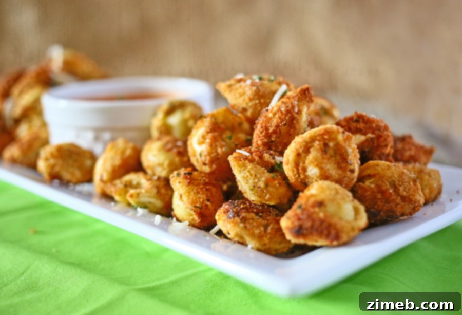 A plate of freshly fried Deep Fried Tortellini, garnished with parsley