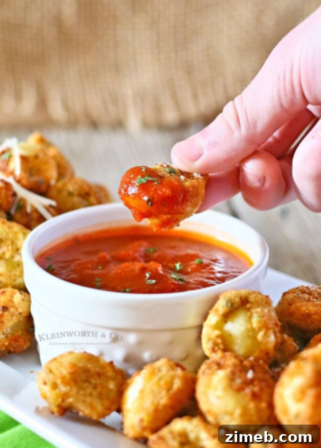 A vibrant platter of Deep Fried Tortellini ready to be served