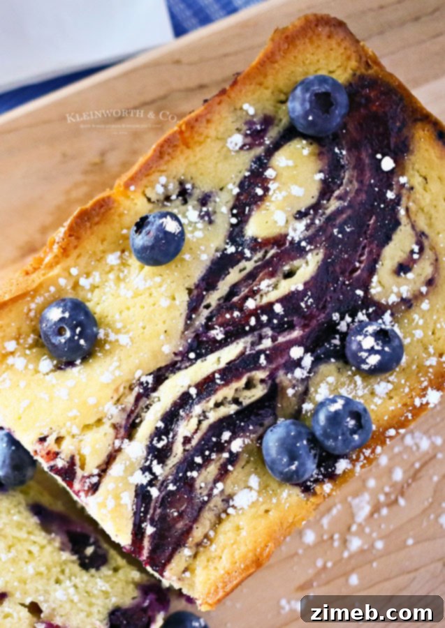 Luscious Blueberry Swirl Pound Cake 2 Close-up of a slice of Blueberry Swirl Pound Cake, showing the beautiful berry swirls.