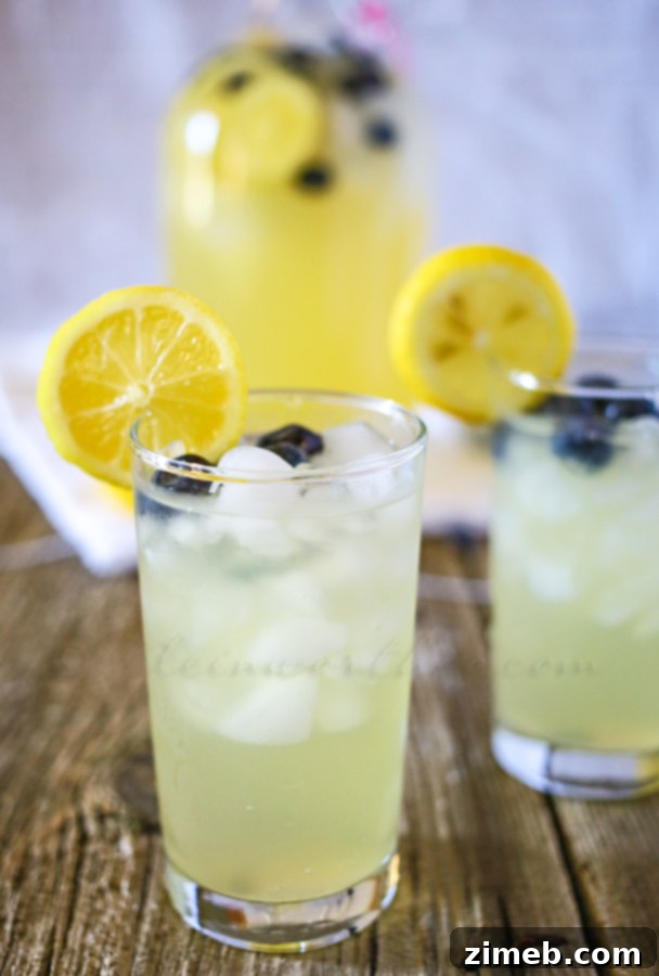 Zesty Blueberry Lemon Green Tea 2 Refreshing Blueberry Lemon Green Tea in a glass with fresh fruit