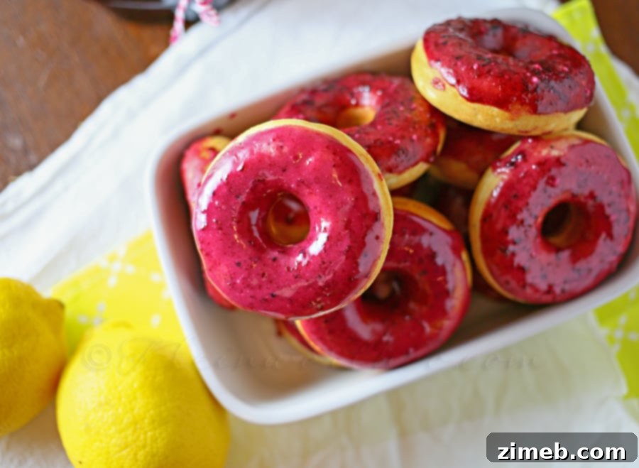Lemon Poppy Seed Donuts topped with Lemon Blueberry Glaze 4 Lemon Poppy Seed Donuts with Lemon Blueberry Glaze