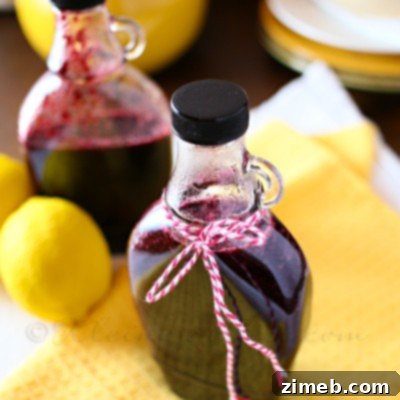 Zesty Lemon Blueberry Syrup 3 Close-up of freshly made Lemon Blueberry Syrup in a jar