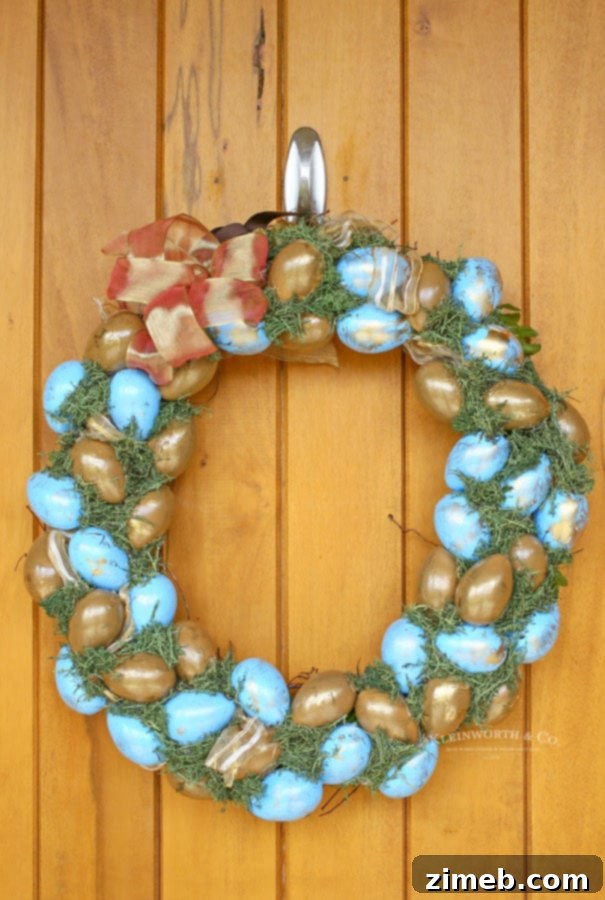 Elegant Blue and Gold Easter Wreath 7 A finished Painted Blue & Gold Easter Wreath hanging on a door, ready to welcome spring visitors.