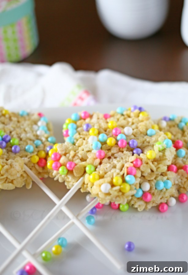 Colorful Easter Krispie Delights 3 Close-up of Easter Krispie Pops being pressed into a flower-shaped pan, showcasing the simple preparation.