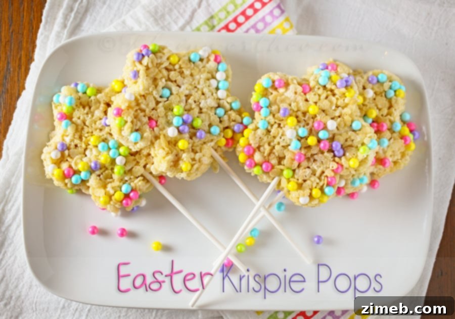 Colorful Easter Krispie Delights 4 A trio of finished Easter Krispie Pops, brightly colored with pastel candies, ready for a spring celebration.