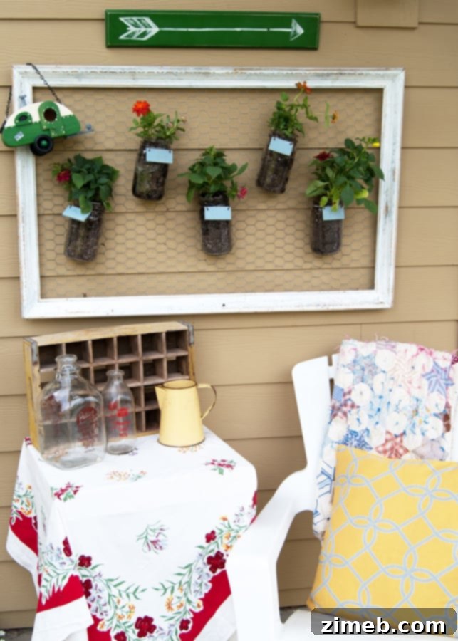 Beautifully styled Mason Jar Wall Garden with vintage and rustic decor elements