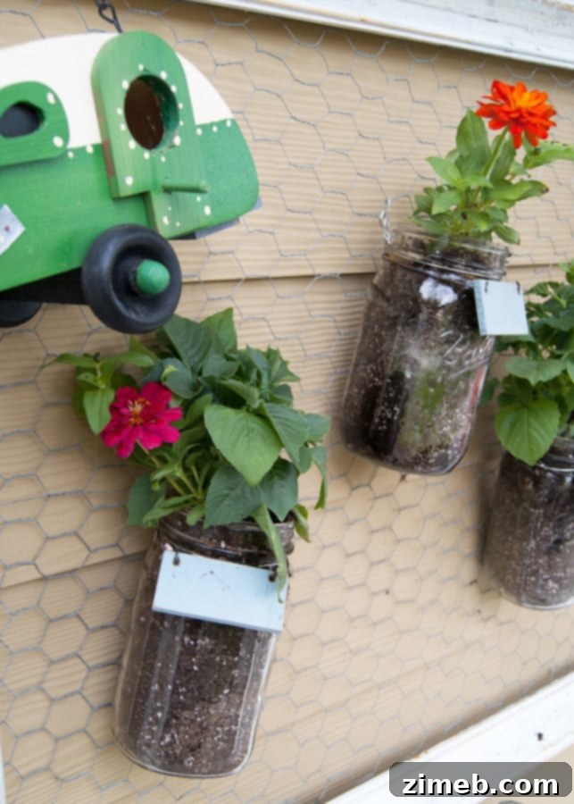 Close-up of a beautifully styled Mason Jar Wall Garden, showcasing healthy plants