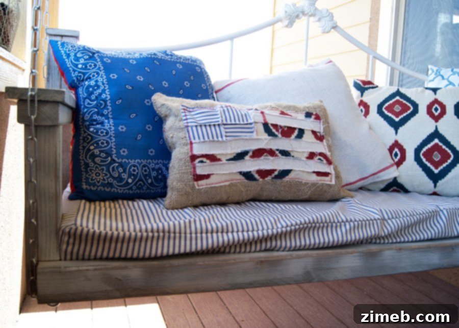 Cozy Patchwork Flag Pillow 8 Scrappy Flag Pillow styled on an Americana themed porch swing