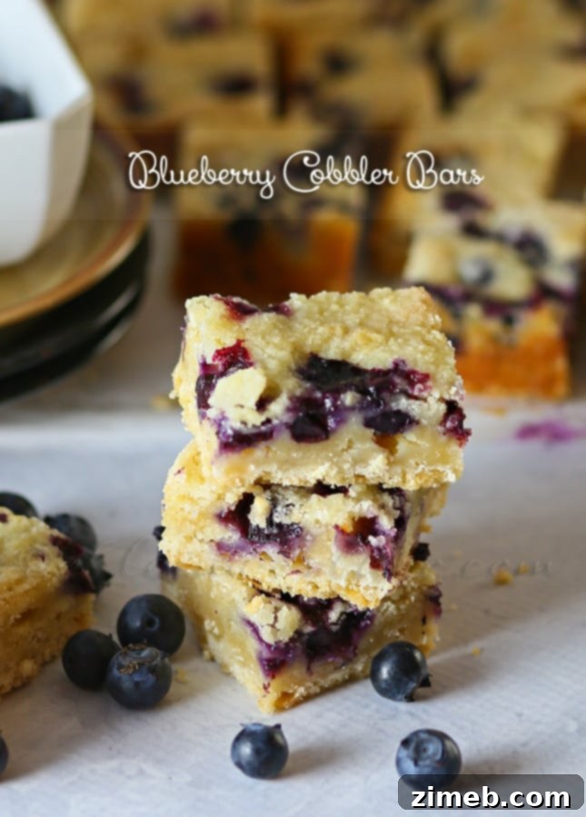 Blueberry Patch Dessert Slices 8 Platter of Blueberry Cobbler Bars, dusted lightly with powdered sugar.
