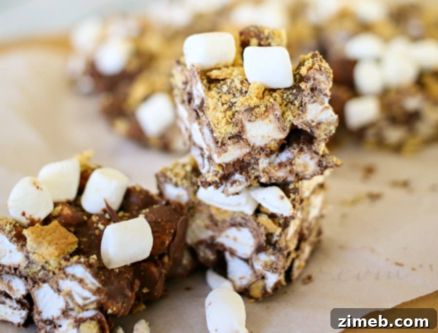 The three simple ingredients for no-bake s'mores bars: milk chocolate chips, mini marshmallows, and graham crackers