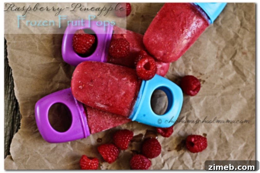 Zesty Berry Bliss Sorbet 7 Refreshing Raspberry-Pineapple Frozen Fruit Pops arranged beautifully on a serving tray, a healthy frozen treat option.
