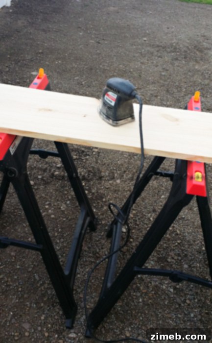 DIY Pallet Console Table Sanding Edges of Custom Table Top
