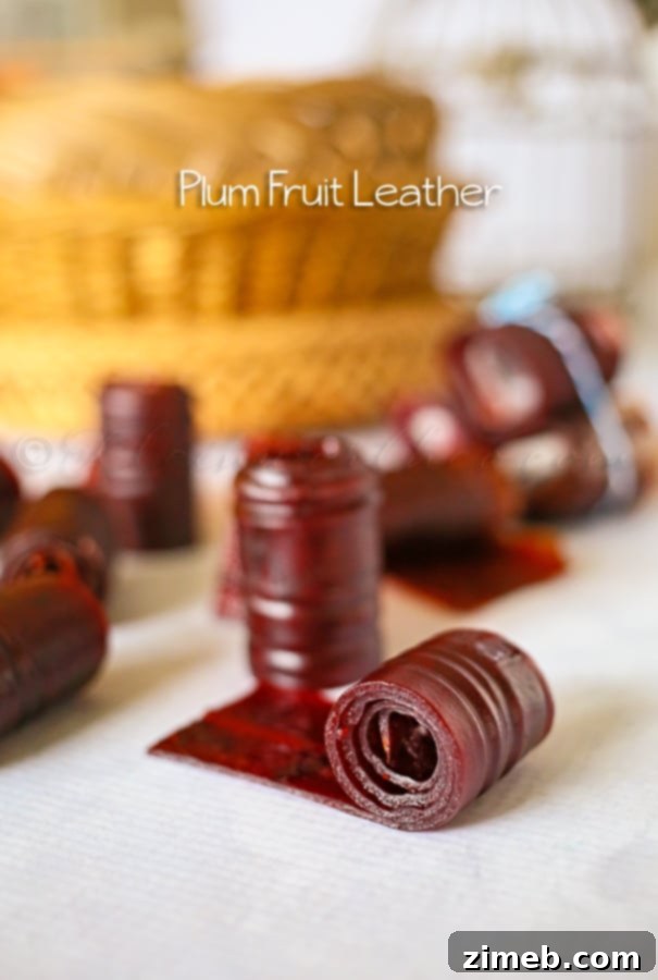 Sun-Kissed Plum Leather 5 Finished plum fruit leather on parchment paper, dried and ready to be cut into strips.