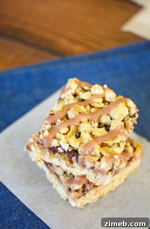A side view of the Fig Crumble Bars, showcasing the thick layer of fig butter between the two crumble layers.
