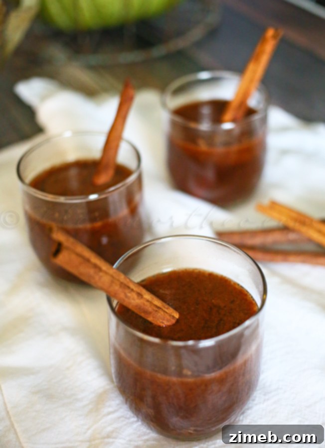 Pumpkin Buttered Rum in a cozy fall setting