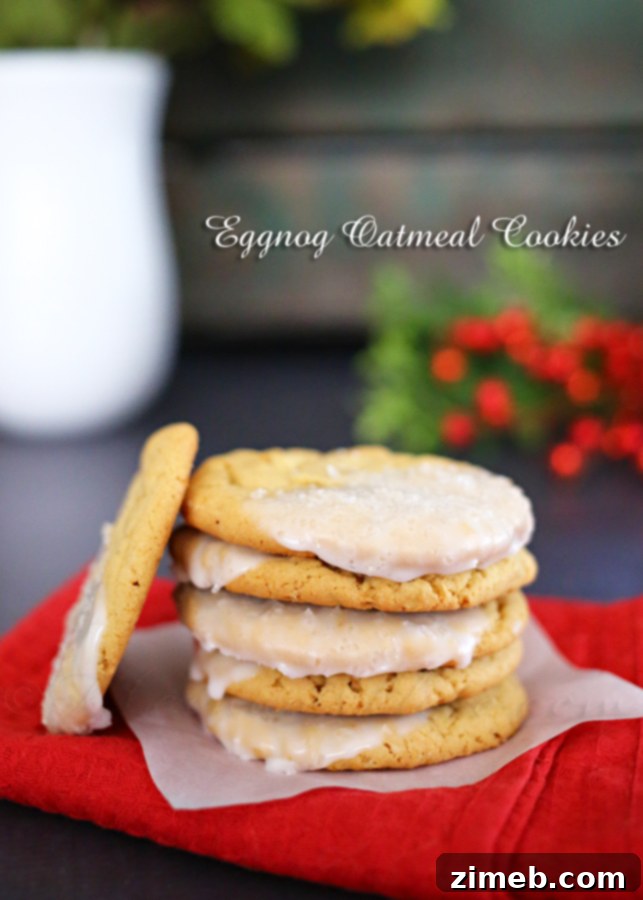 Cozy Eggnog Oatmeal Cookies 6 Several freshly baked Eggnog Oatmeal Cookies with delicate eggnog icing and festive sprinkles on a wire rack