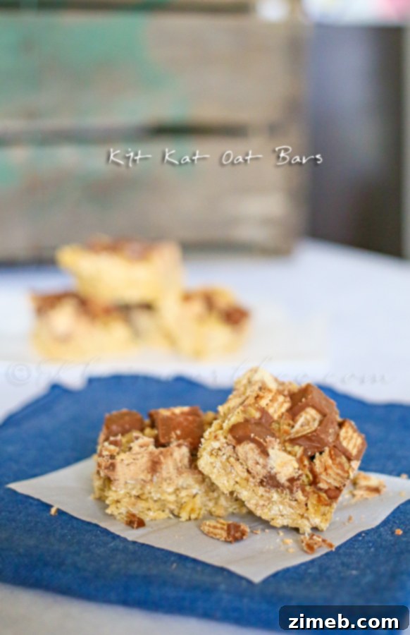 Homemade No-Bake Kit Kat Treats A stack of golden Kit Kat Oat Bars, ready to be served as an easy dessert.
