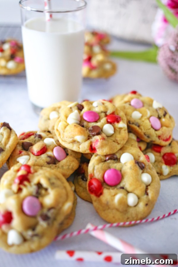 Valentine Chocolate Chip Cookies Close-up of freshly baked Valentine Chocolate Chip Cookies, showing their soft centers and colorful M&M's, ideal for a festive holiday treat.