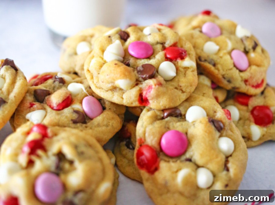Valentine Chocolate Chip Cookies Ingredients for Valentine Chocolate Chip Cookies, including butter, sugars, chocolate chips, and festive M&M's.