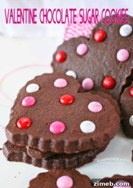 Heartfelt Chocolate Chip Cookies 3 Valentine Chocolate Sugar Cookies decorated with festive sprinkles and icing, perfect for a sweet holiday treat.