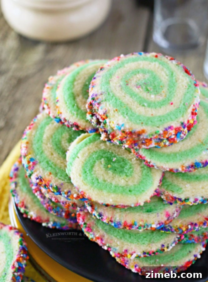 Kaleidoscope Pinwheels 2 Green and white St. Patrick's Day cookies with rainbow sprinkles