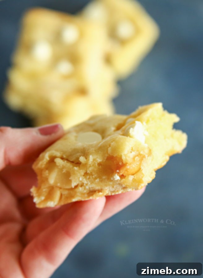 Decadent White Chocolate Macadamia Blondies 5 how to make White Chocolate Macadamia Nut Blondies, showing final baked state