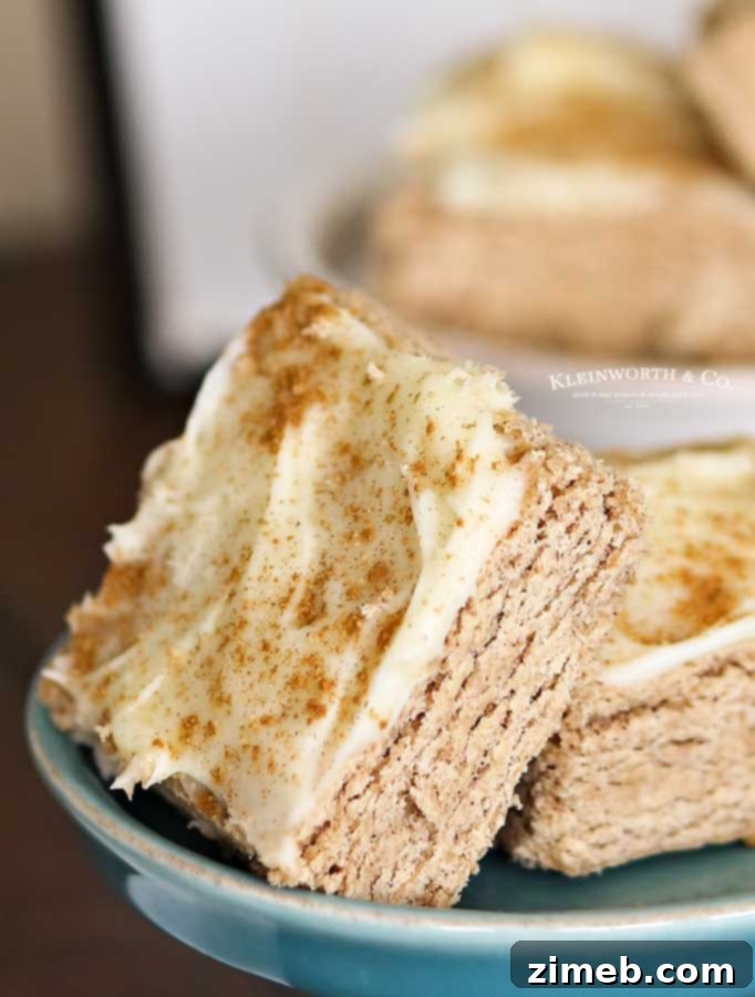 Cinnamon Roll Sugar Cookie Bars with thick cream cheese frosting