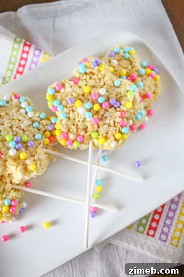 Hoppy Easter Pudding Cups 11 Easter Krispie Pops, a fun and colorful treat for Easter parties.