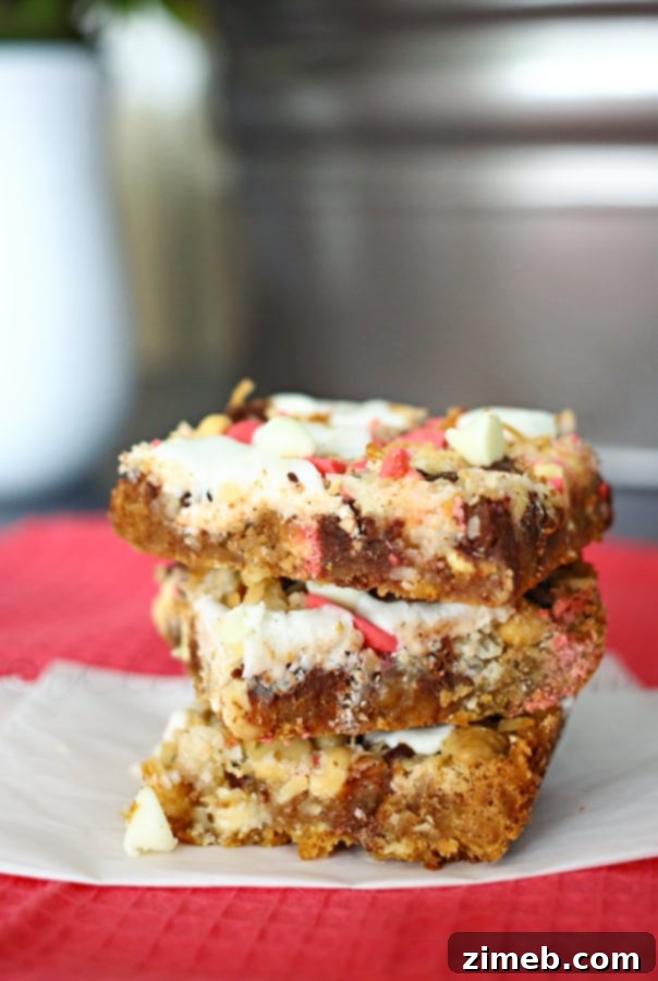 Close-up of a pan of freshly baked Spring Seven Layer Bars, showcasing the layers of chocolate chips, coconut, and marshmallows on a graham cracker crust