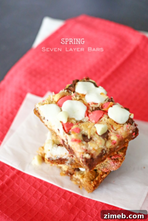 Spring Seven Layer Bars displayed on a serving plate, ready to be enjoyed with a glass of milk