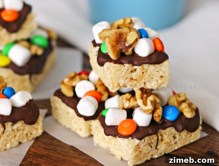 Delicious Rocky Road Krispie Bar Recipe 2 Rocky Road Krispies Treats - A delicious and easy no-bake dessert featuring crispy rice cereal, melted chocolate, mini marshmallows, walnuts, and M&M's.